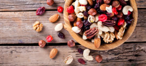 Nuts and dried fruit mix. Concept of Healthy Food. Vintage wooden background. Copy space for Text. selective focus